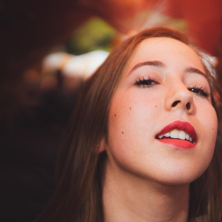 Aanya Shah, Lead Design Curator at ThreadLoomCraft, reviewing corporate floral arrangements